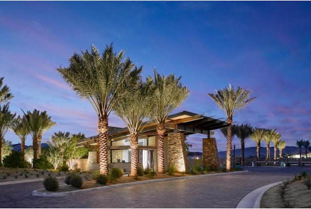 view of outdoor building at dusk