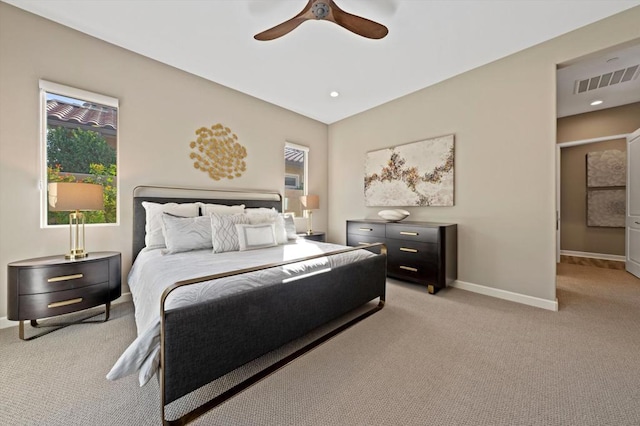 bedroom featuring ceiling fan and light carpet