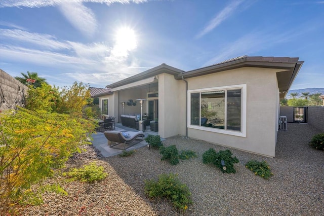 back of property featuring a patio