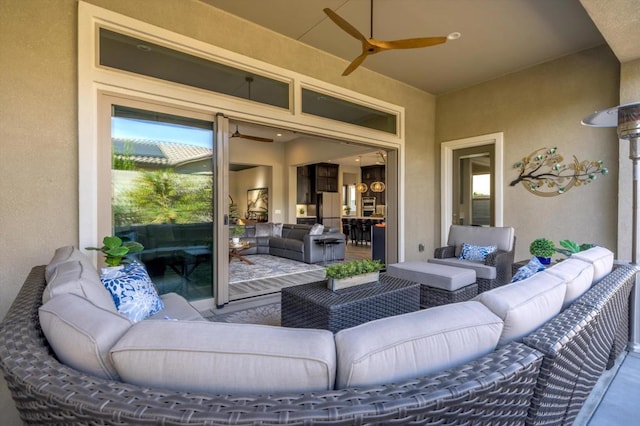 view of patio featuring an outdoor hangout area and ceiling fan