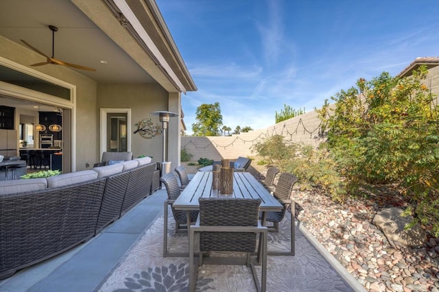 view of patio featuring an outdoor hangout area and ceiling fan