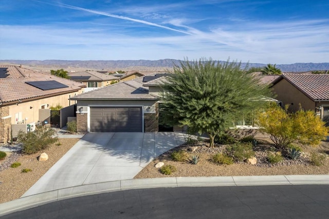 view of front of house featuring a mountain view and a garage