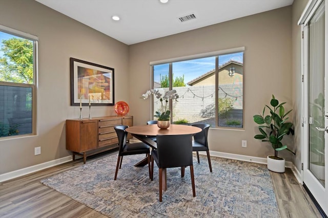 dining area with wood-type flooring