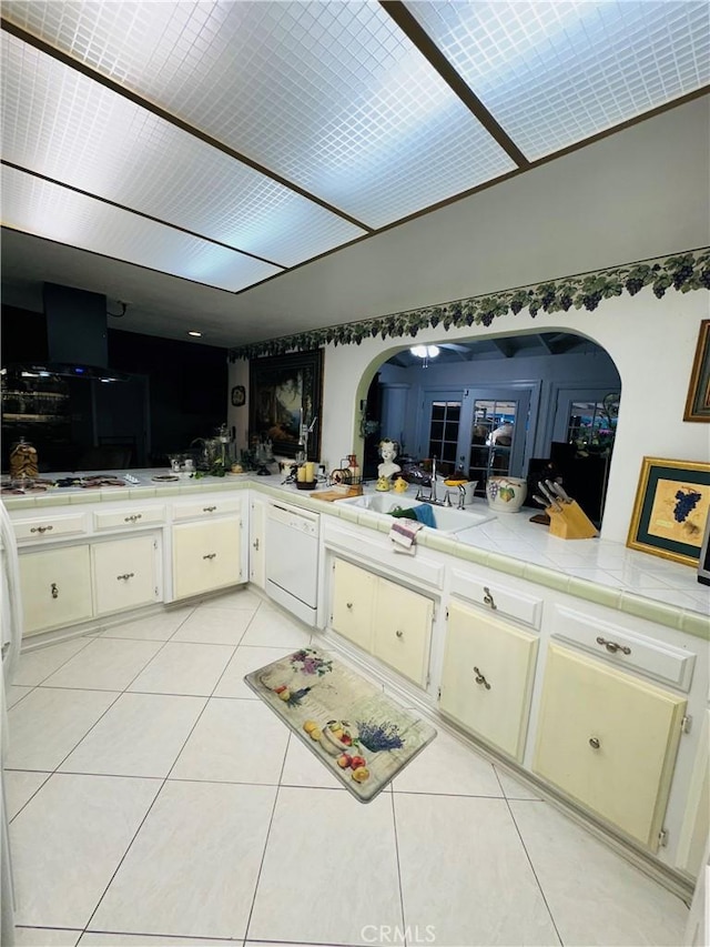 bathroom with tile patterned flooring, ceiling fan, and sink