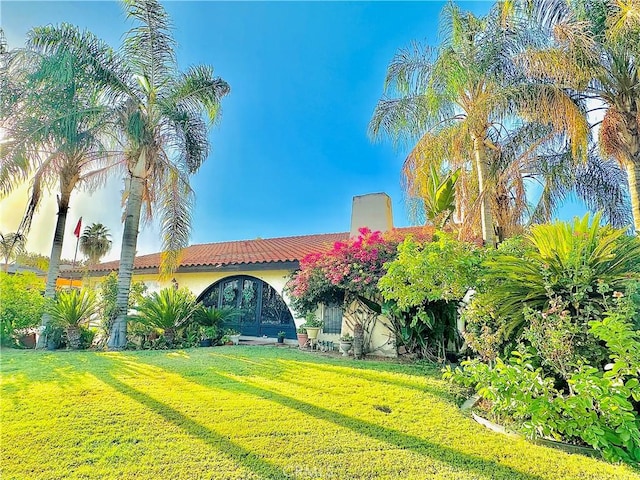 view of front of home with a front yard