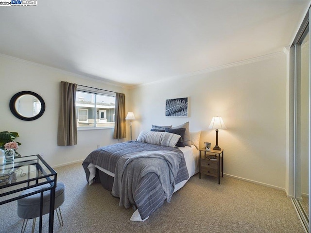 bedroom featuring ornamental molding and carpet flooring