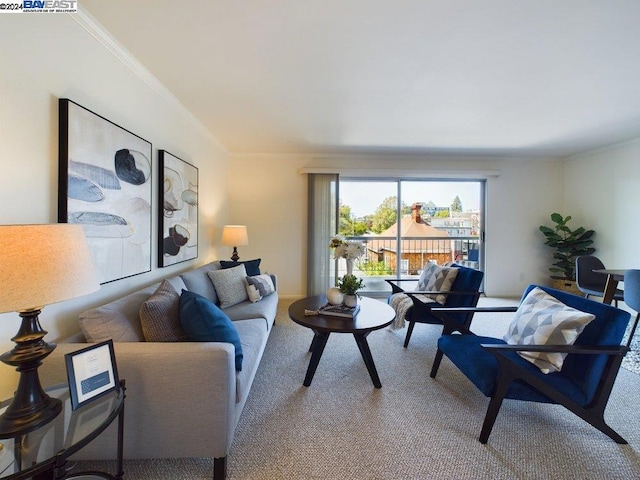 living room featuring ornamental molding and carpet flooring