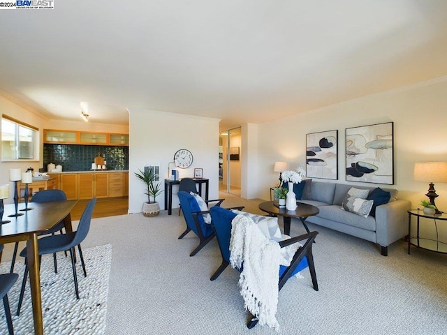 living room with light carpet and ornamental molding