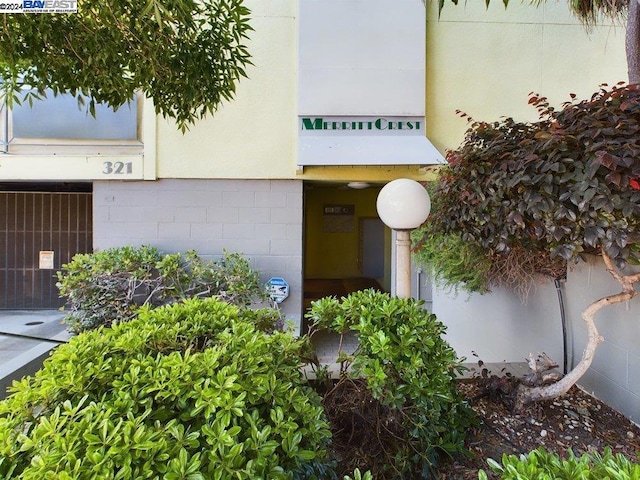 entrance to property with central AC unit