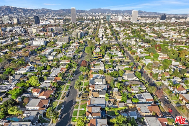 birds eye view of property with a mountain view