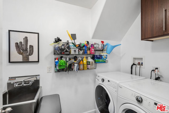 laundry area with cabinets and independent washer and dryer