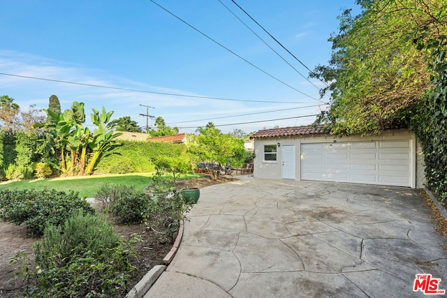 garage with a lawn