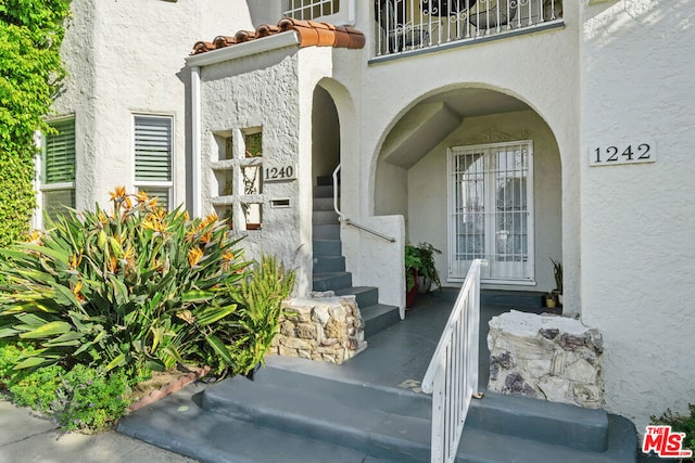 doorway to property featuring a balcony