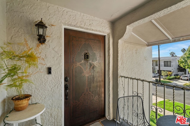 doorway to property with a balcony