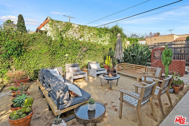 view of patio with an outdoor fire pit