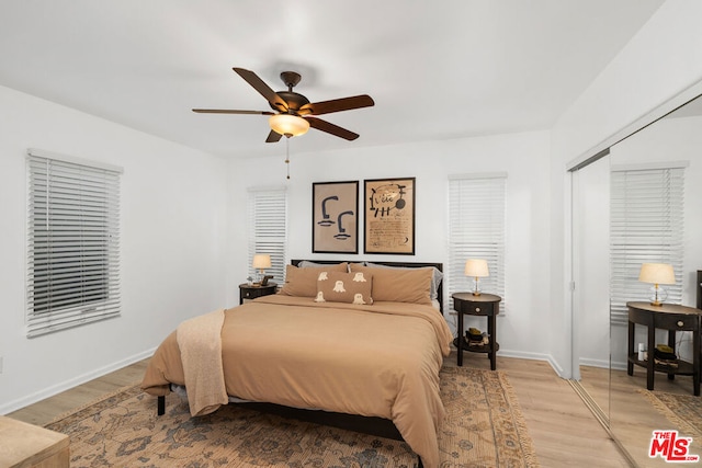 bedroom featuring ceiling fan and wood-type flooring