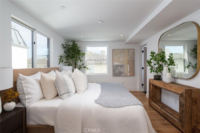 bedroom with wood-type flooring