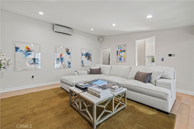 living room with a wall mounted air conditioner, hardwood / wood-style floors, and vaulted ceiling