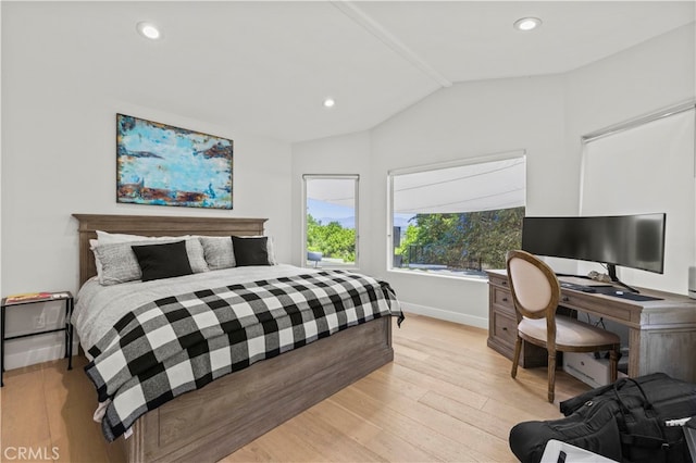 bedroom with light hardwood / wood-style floors and vaulted ceiling