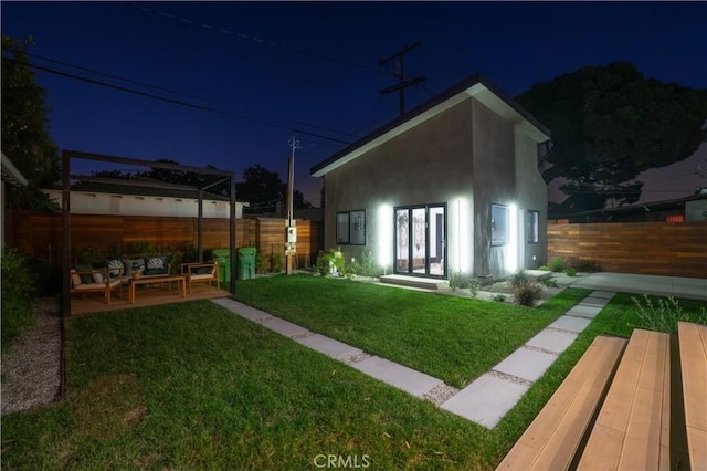 yard at twilight with french doors