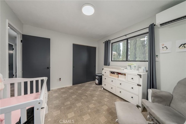 bedroom featuring an AC wall unit