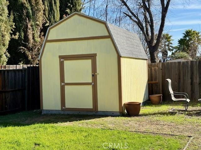 view of shed featuring a fenced backyard