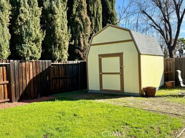 view of shed featuring a fenced backyard