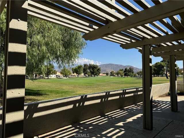 view of patio with a mountain view and a pergola