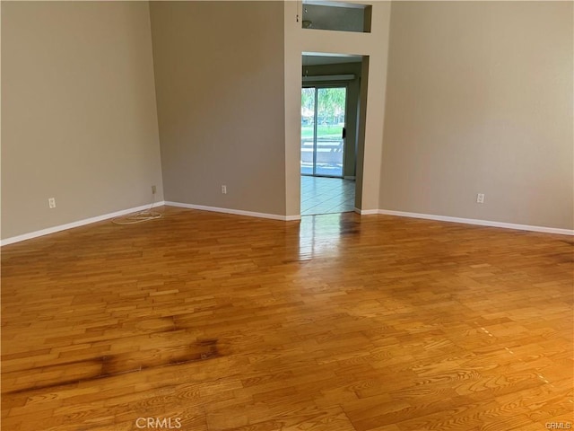 spare room with light hardwood / wood-style floors