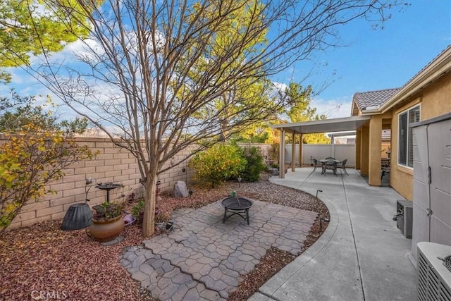 view of patio / terrace featuring a fire pit