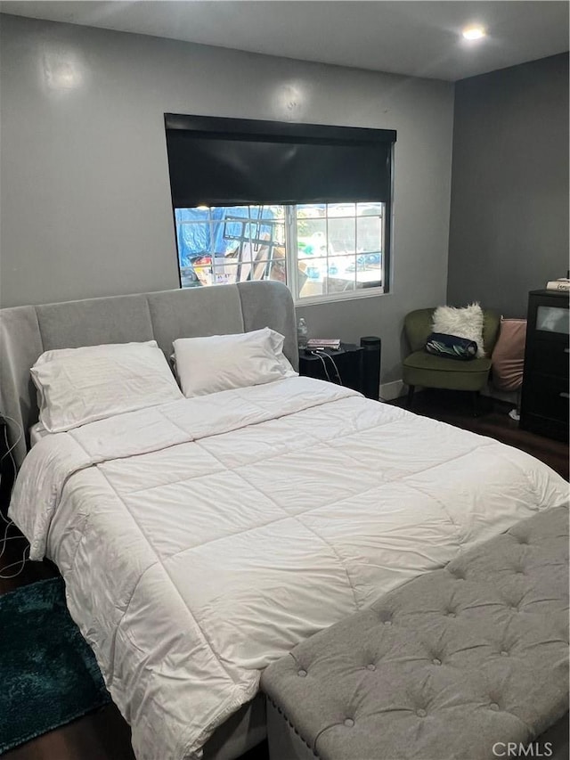 bedroom with wood-type flooring