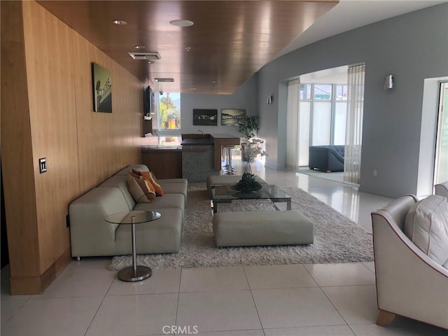 tiled living room with wooden walls