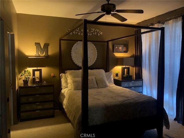 bedroom featuring ceiling fan and light carpet