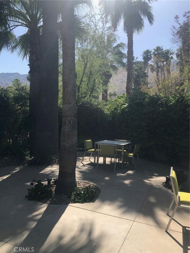 view of patio / terrace featuring a mountain view