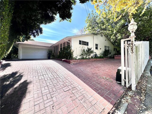 view of front of property with a garage