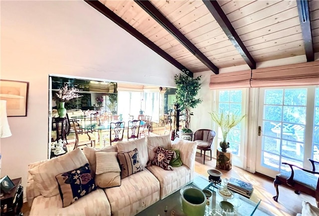 living room with wood ceiling, light hardwood / wood-style floors, high vaulted ceiling, and beamed ceiling