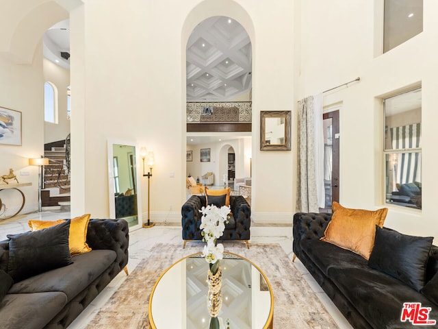 living room featuring a high ceiling