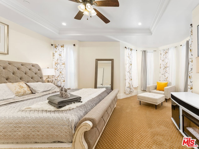 bedroom with ceiling fan, light colored carpet, crown molding, and a raised ceiling