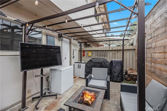 view of patio / terrace featuring a pergola and an outdoor fire pit