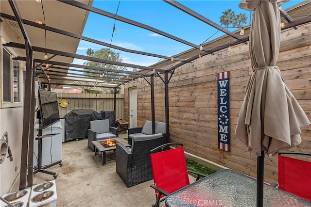 view of patio featuring a fire pit