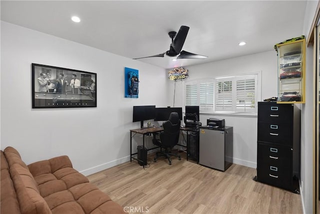 office space featuring ceiling fan and light wood-type flooring