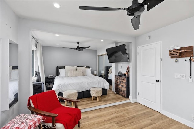 bedroom featuring hardwood / wood-style floors and ceiling fan