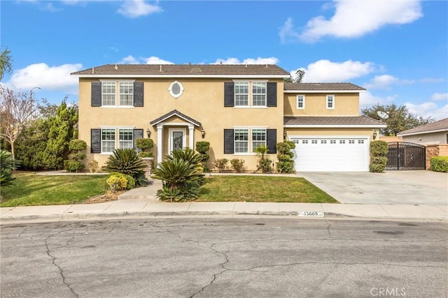 view of front of property with a front yard and a garage