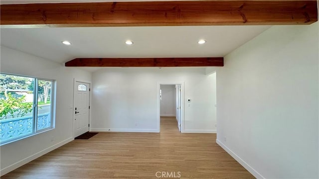 interior space with light wood-style flooring, baseboards, beamed ceiling, and recessed lighting