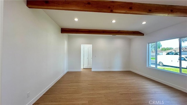 unfurnished room with lofted ceiling with beams, light wood-style floors, recessed lighting, and baseboards