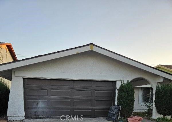 property exterior at dusk with a garage