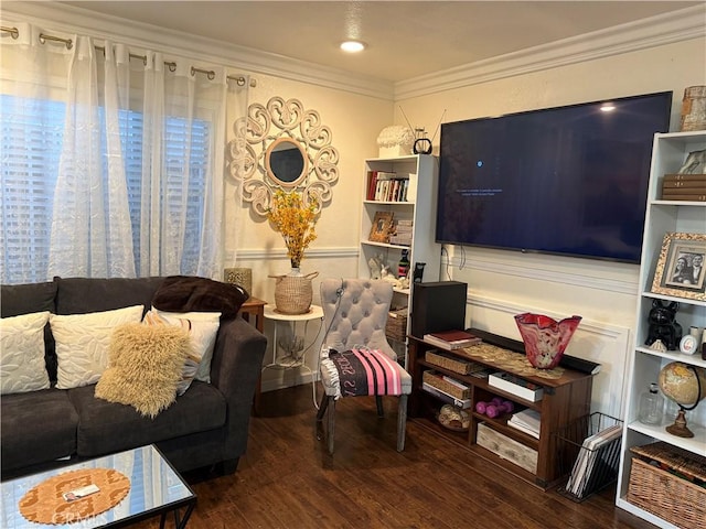 living room with crown molding and dark wood-type flooring