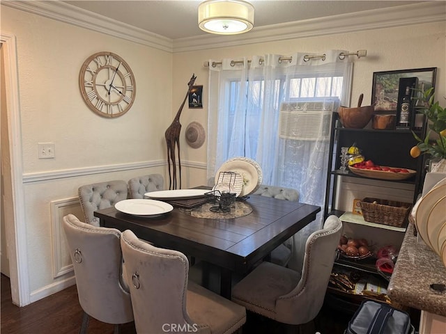 dining area featuring dark hardwood / wood-style floors and ornamental molding