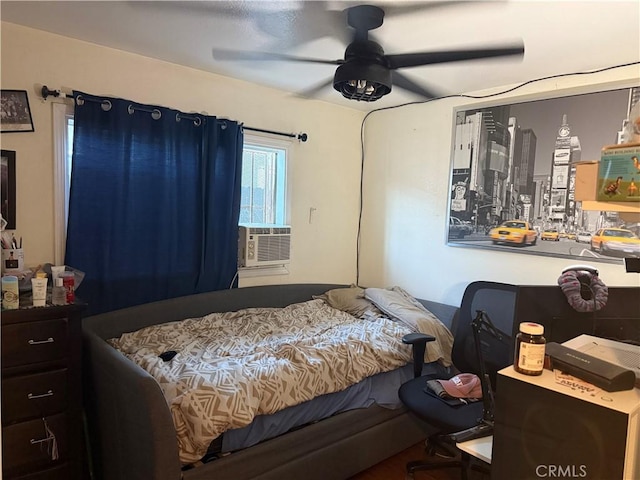 bedroom with ceiling fan and cooling unit