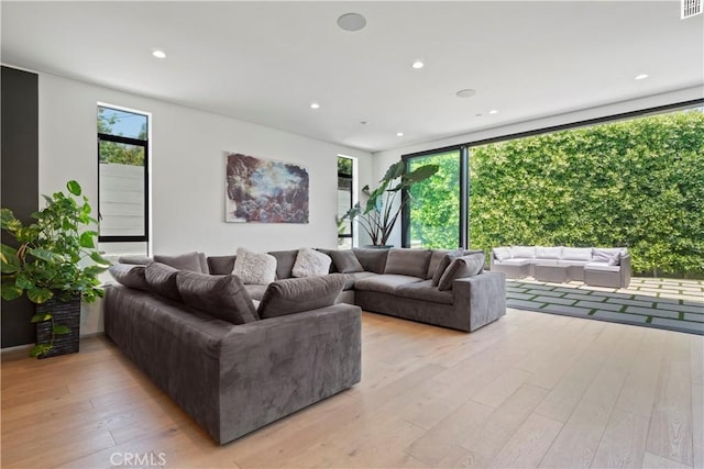 living room with light hardwood / wood-style floors